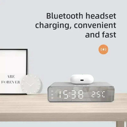 All-in-One Wireless Alarm Dock with fast charging, digital thermometer, and LED display for iPhone and Samsung devices on a nightstand